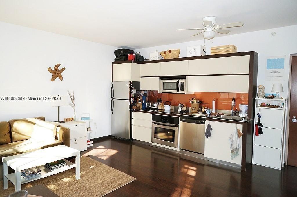 435 21st Street, Unit 215 Miami Beach, FL 33139 - Photo 5 of 14 a kitchen with stainless steel appliances granite countertop a stove and a refrigerator