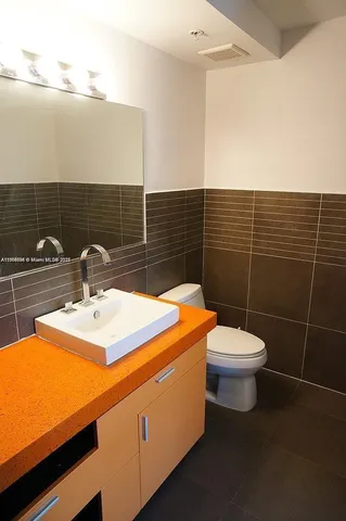 a bathroom with a sink and toilet