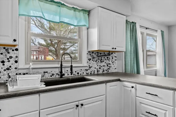 a kitchen with a sink and a window
