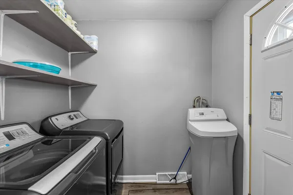 a utility room with dryer and washer