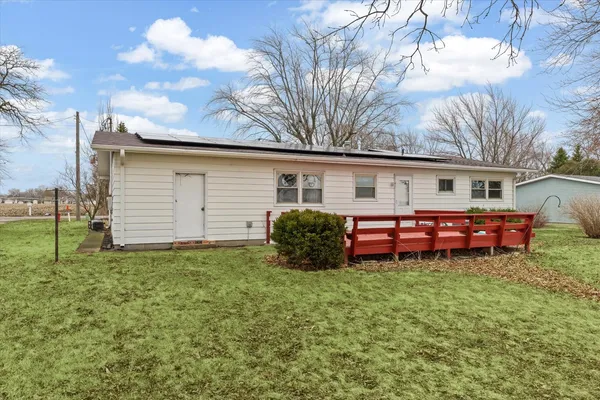 a house view with a sitting space and garden