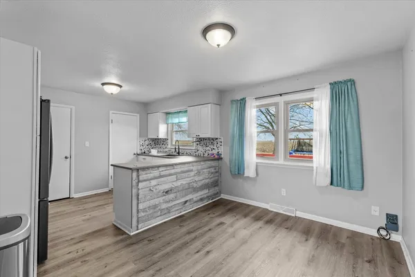 a room with a bed and a window