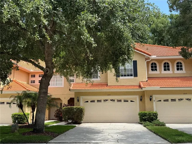 a large building with a tree in front of it