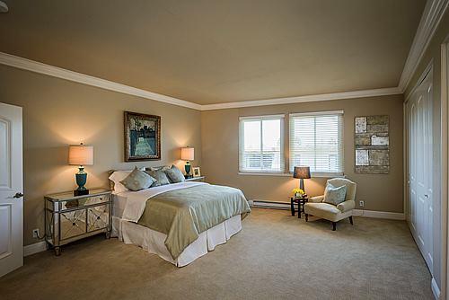 500 Almer Road, Unit 309 Burlingame, CA 94010 - Photo 15 of 20 a spacious bedroom with a bed and a window