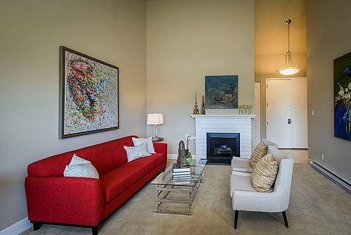 500 Almer Road, Unit 309 Burlingame, CA 94010 - Photo 4 of 20 a living room with furniture and a fireplace