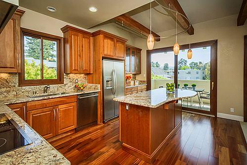 500 Almer Road, Unit 309 Burlingame, CA 94010 - Photo 10 of 20 a kitchen with stainless steel appliances granite countertop a refrigerator a sink dishwasher a stove and white countertops with wooden floor