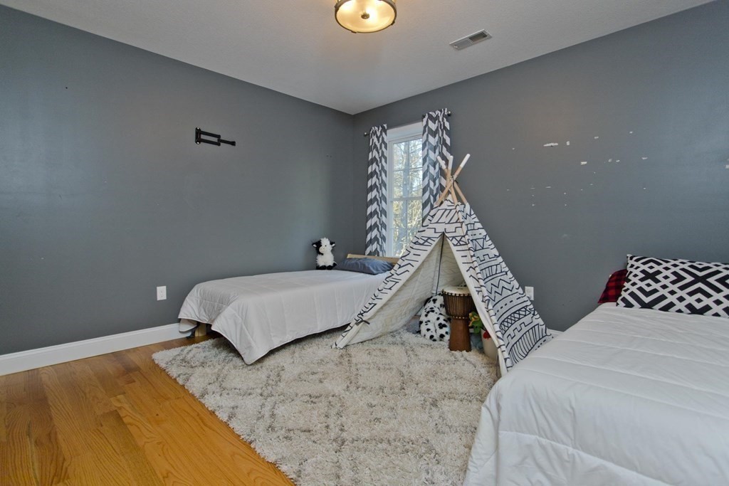 75 Moose Brook Road Southampton, MA 01073 - Photo 25 of 38 a bedroom with a bed and a window
