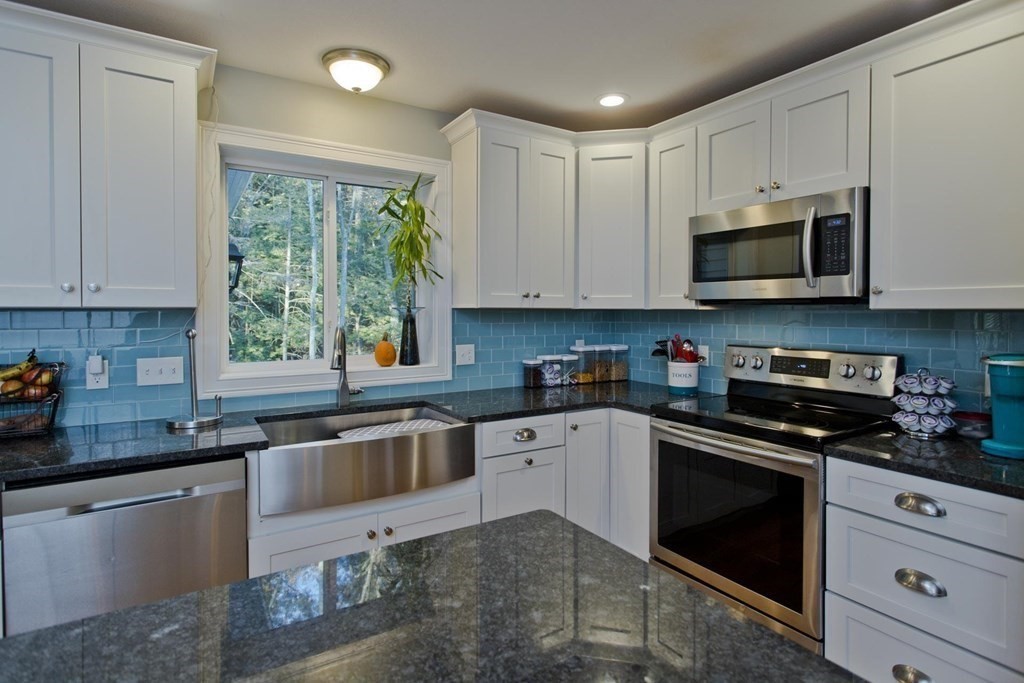 75 Moose Brook Road Southampton, MA 01073 - Photo 9 of 38 a kitchen with cabinets appliances a sink and a window