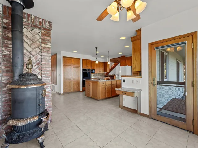 a view of a house with backyard sitting area and garden