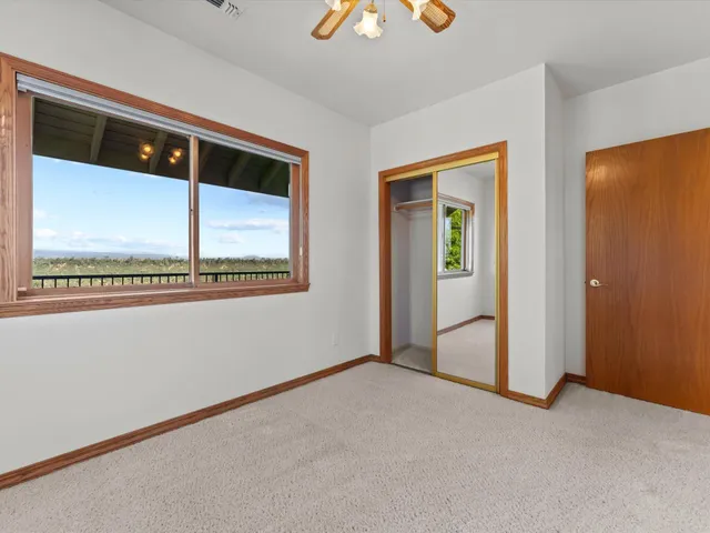 a view of a lake with houses in the back