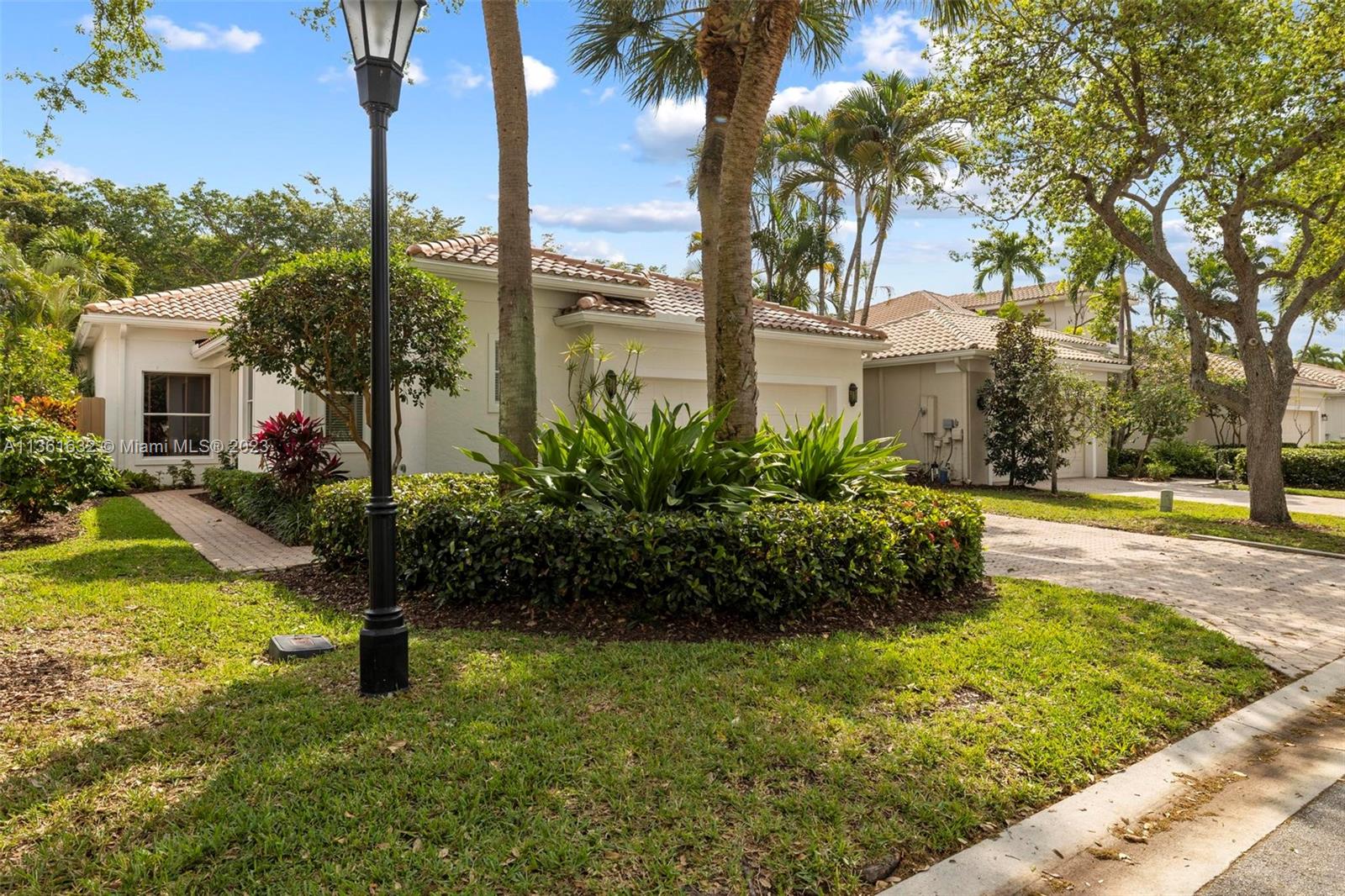 6666 Northwest 23rd Terrace Boca Raton, FL 33496 - Photo 1 of 38 a view of a yard with palm trees