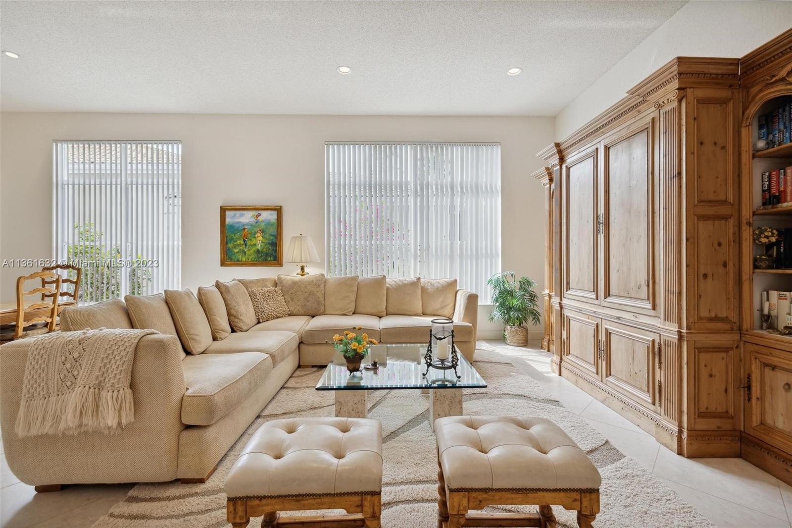 6666 Northwest 23rd Terrace Boca Raton, FL 33496 - Photo 2 of 38 a living room with furniture fireplace and a window