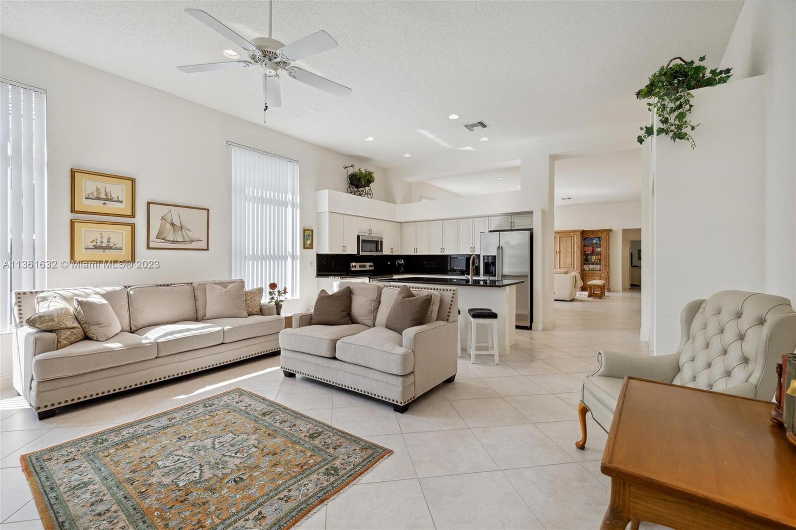 6666 Northwest 23rd Terrace Boca Raton, FL 33496 - Photo 6 of 38 a living room with furniture and a couch