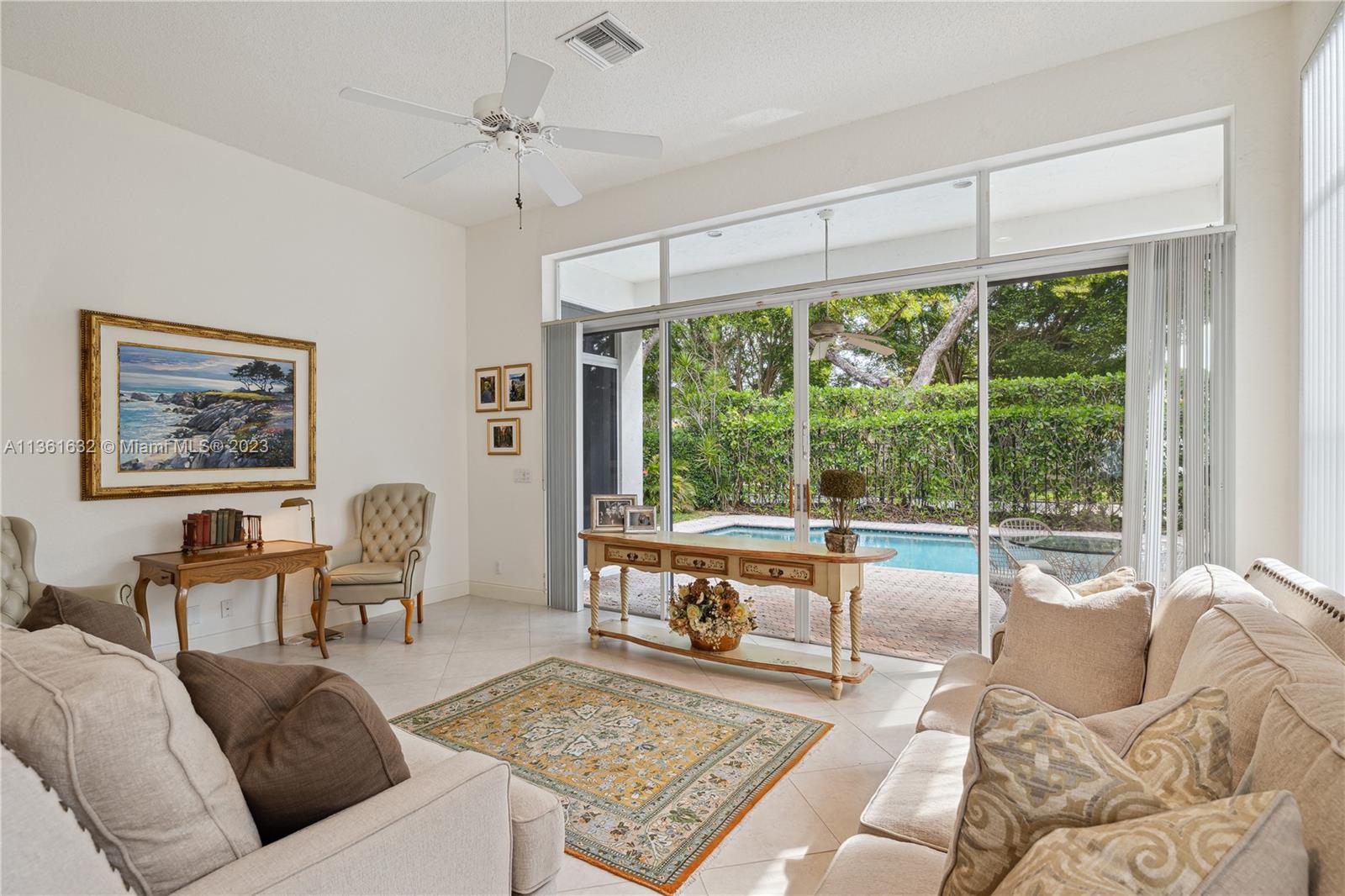 6666 Northwest 23rd Terrace Boca Raton, FL 33496 - Photo 7 of 38 a living room with furniture and a large window