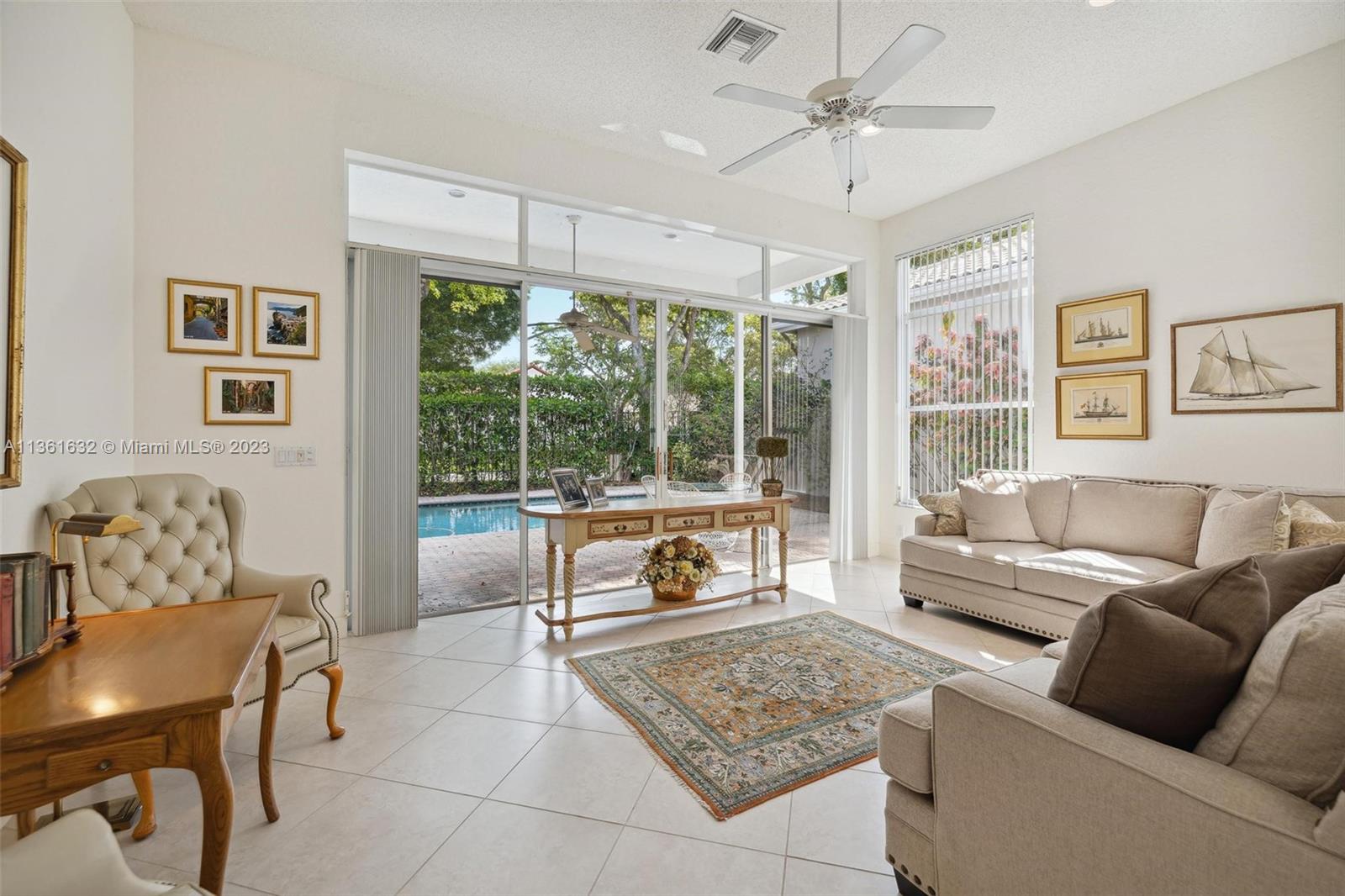 6666 Northwest 23rd Terrace Boca Raton, FL 33496 - Photo 8 of 38 a living room with furniture and a large window