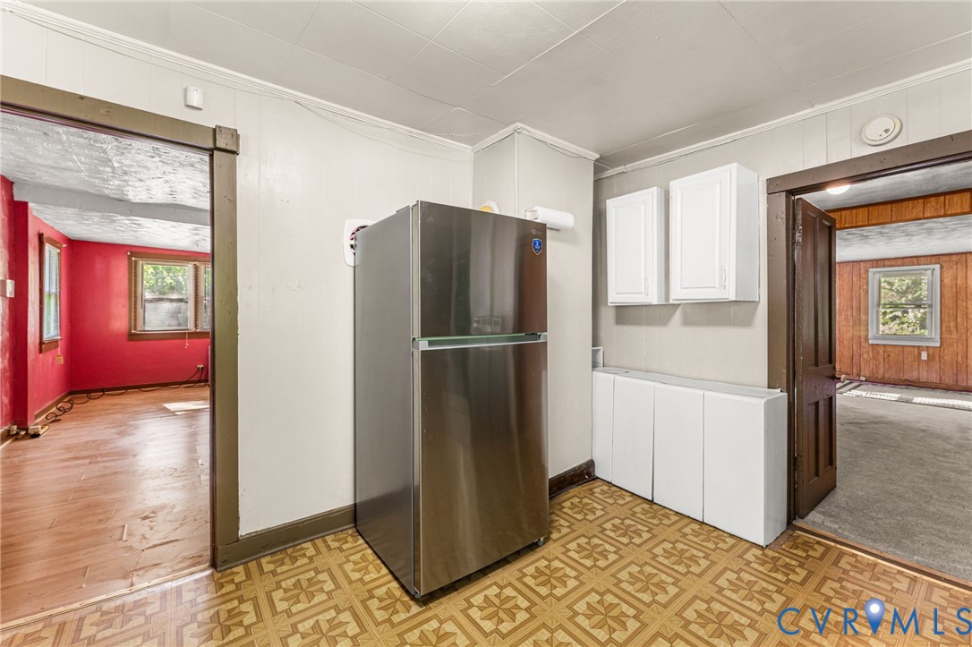 2097 Coles Point Road Hague, VA 22469 - Photo 32 of 34 a view of a kitchen with refrigerator and wooden floor