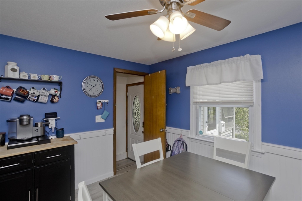 20 Maura Street Springfield, MA 01104 - Photo 10 of 41 a view of a livingroom with furniture cabinet and a chandelier fan