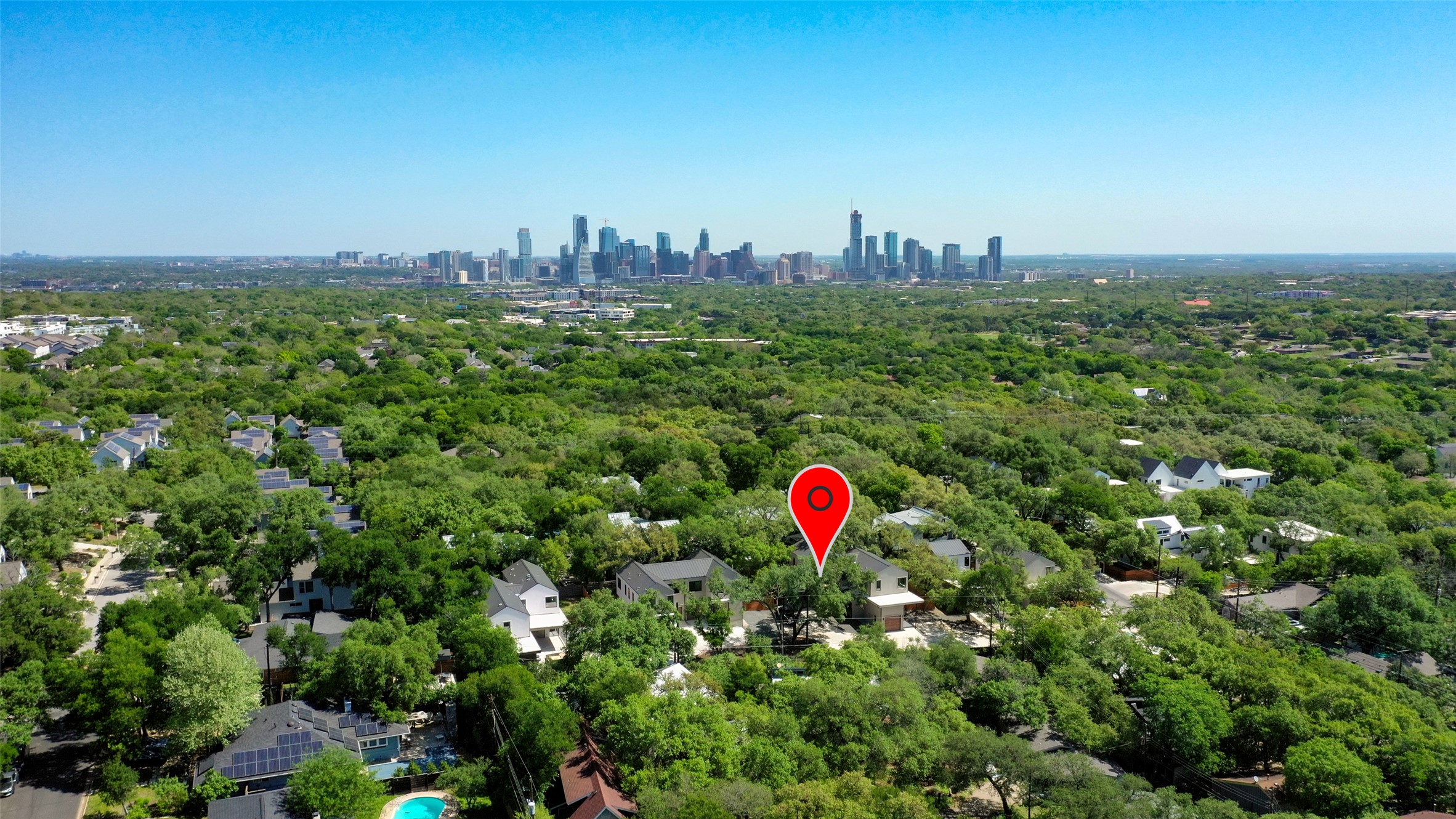 3208 Clawson Road, Unit 5A Austin, TX 78704 - Photo 30 of 34 Drone / aerial view of skyline and a forest