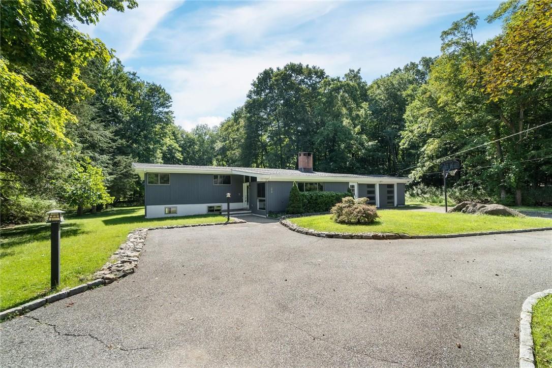 395 Furnace Dock Road Cortlandt Manor, NY 10567 - Photo 1 of 1 a view of a swimming pool with a garden