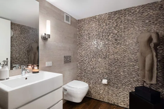 a bathroom with a toilet and a sink