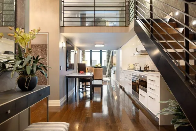a kitchen with stove and cabinets
