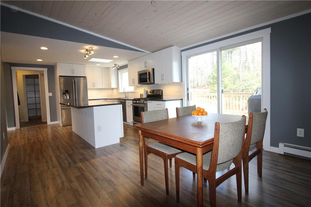 18 Pine Point Road Hope, ME 04847 - Photo 4 of 35 Dining area with sliders to the new...