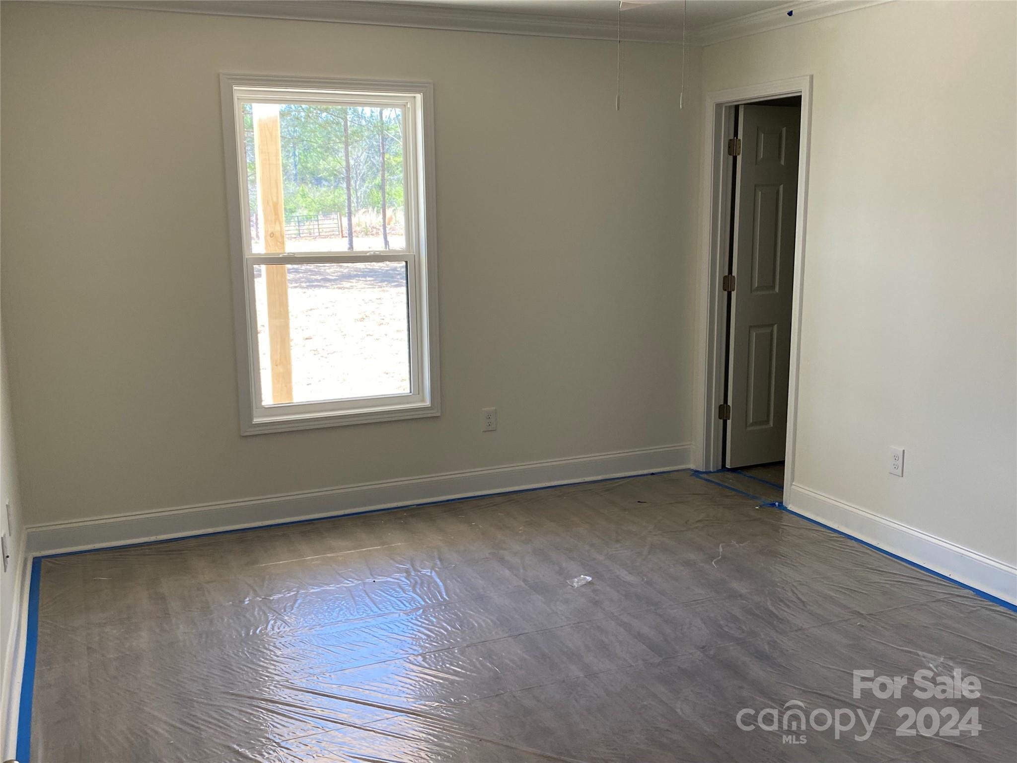 1741 Scenic View Road Hickory Grove, SC 29717 - Photo 6 of 11 an empty room with wooden floor and windows