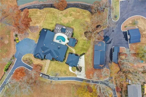 an aerial view of a house with a swimming pool