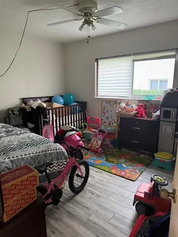 a bedroom with furniture and a window