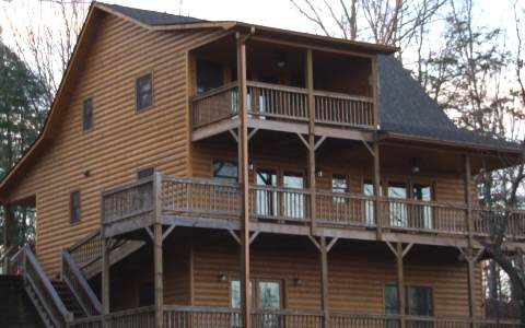440 Ridge Road Blue Ridge, GA 30513 - Photo 1 of 1 a front view of a house with balcony