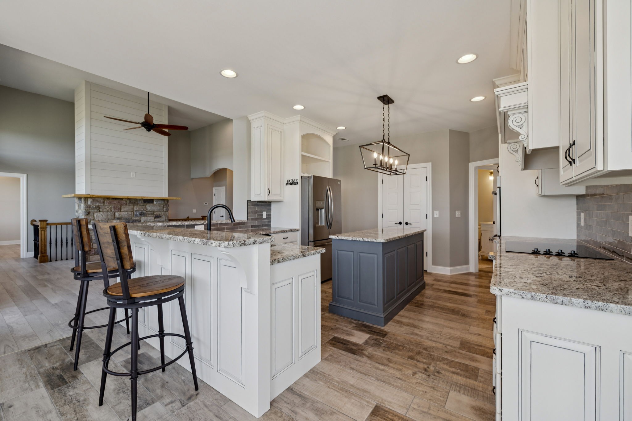 105 Barbara Spears Road Morrison, TN 37357 - Photo 11 of 55 a large kitchen with kitchen island white cabinets and stainless steel appliances