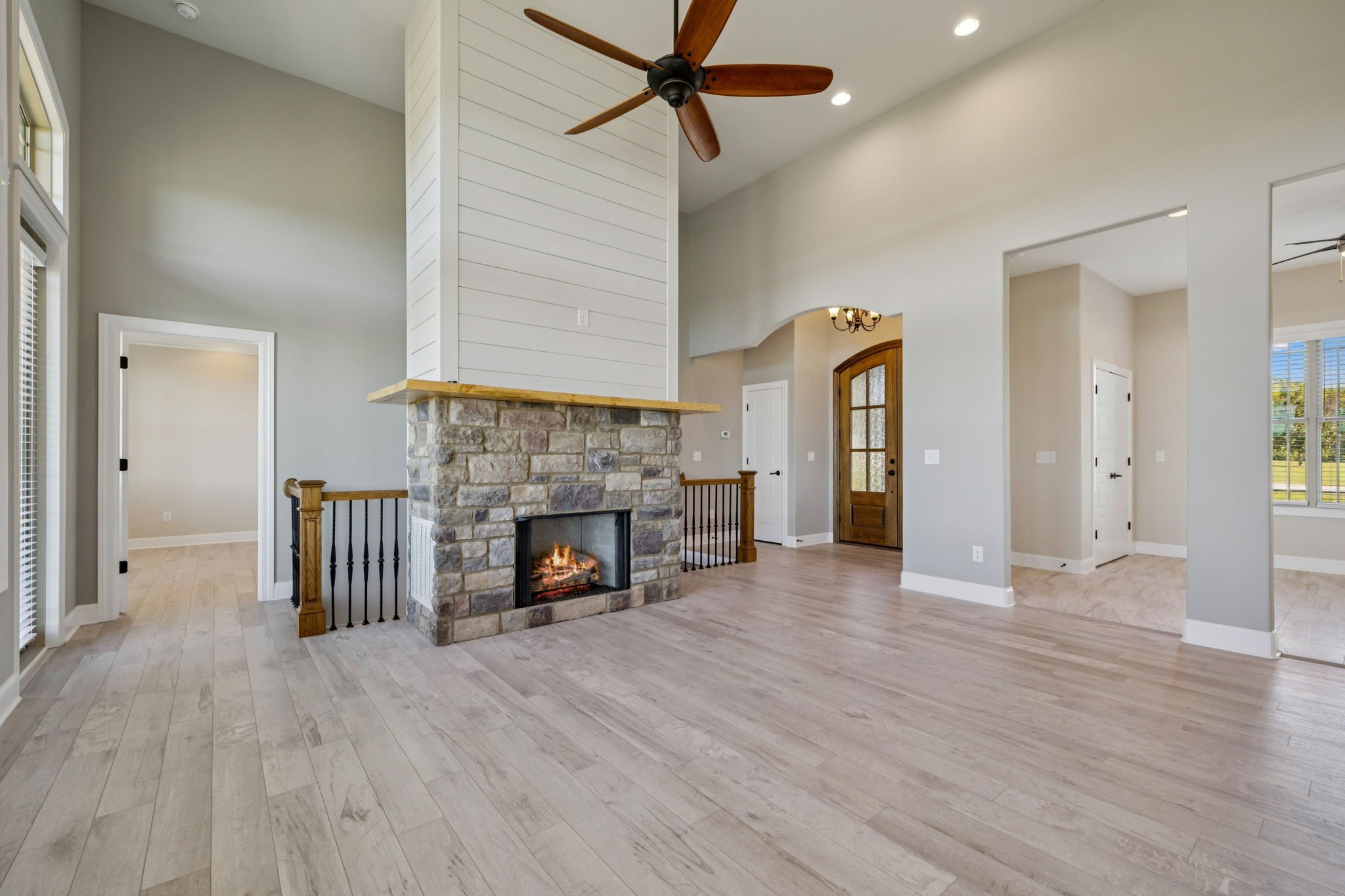 105 Barbara Spears Road Morrison, TN 37357 - Photo 5 of 55 an empty room with wooden floor fireplace and windows