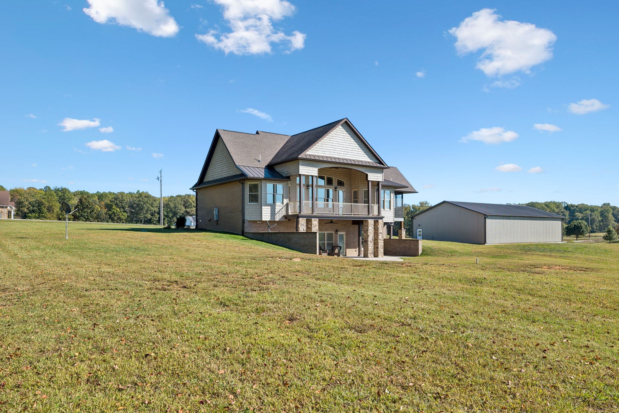 105 Barbara Spears Road Morrison, TN 37357 - Photo 52 of 55 a view of a house with a yard and a garden