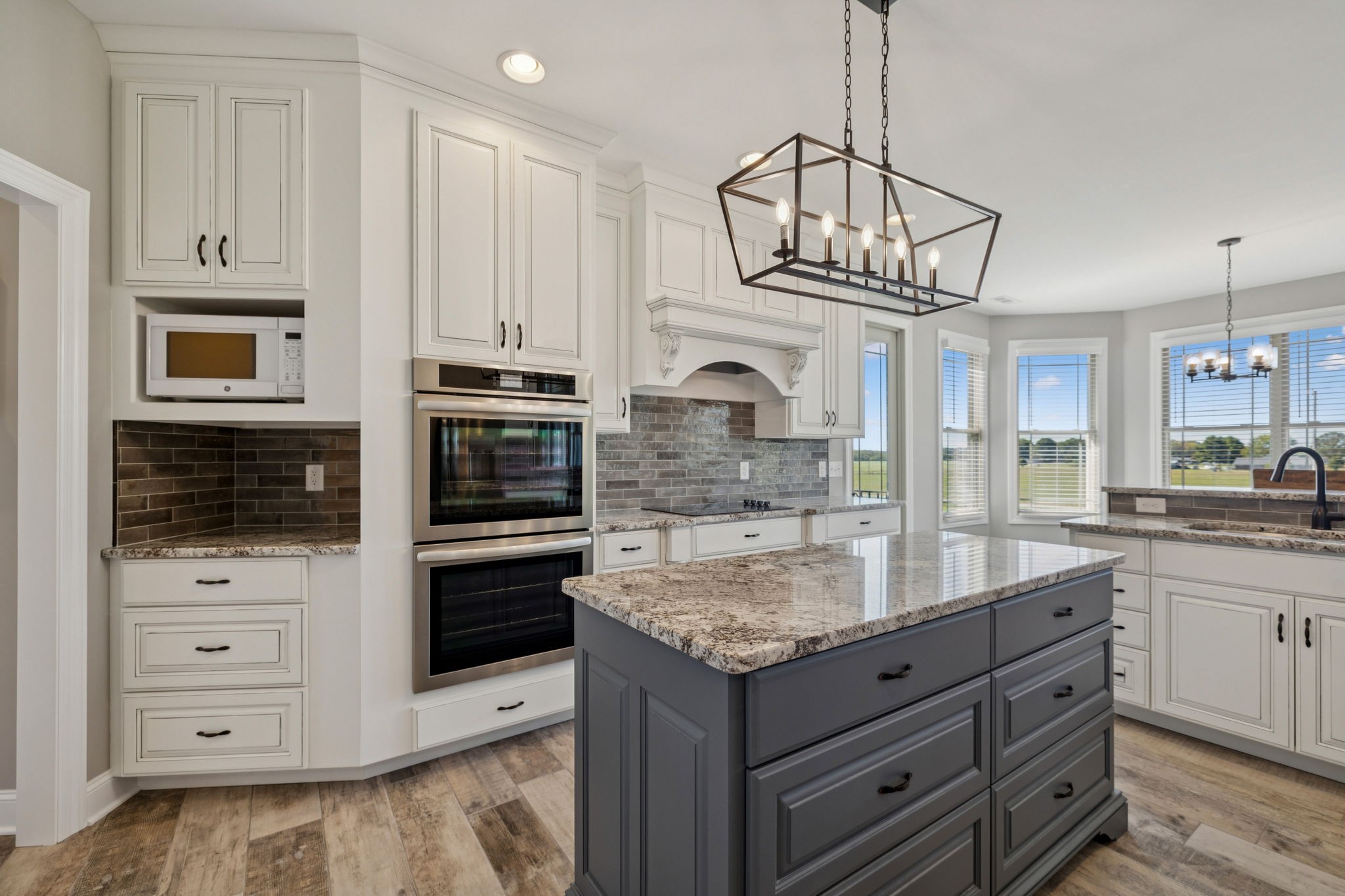 105 Barbara Spears Road Morrison, TN 37357 - Photo 8 of 55 a kitchen with kitchen island granite countertop stainless steel appliances a stove sink and microwave