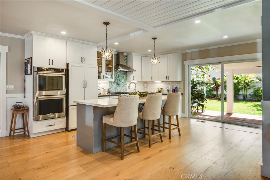 2505 Vail Avenue Redondo Beach, CA 90278 - Photo 22 of 41 a dining room with stainless steel appliances kitchen island granite countertop a table chairs and a view of living room