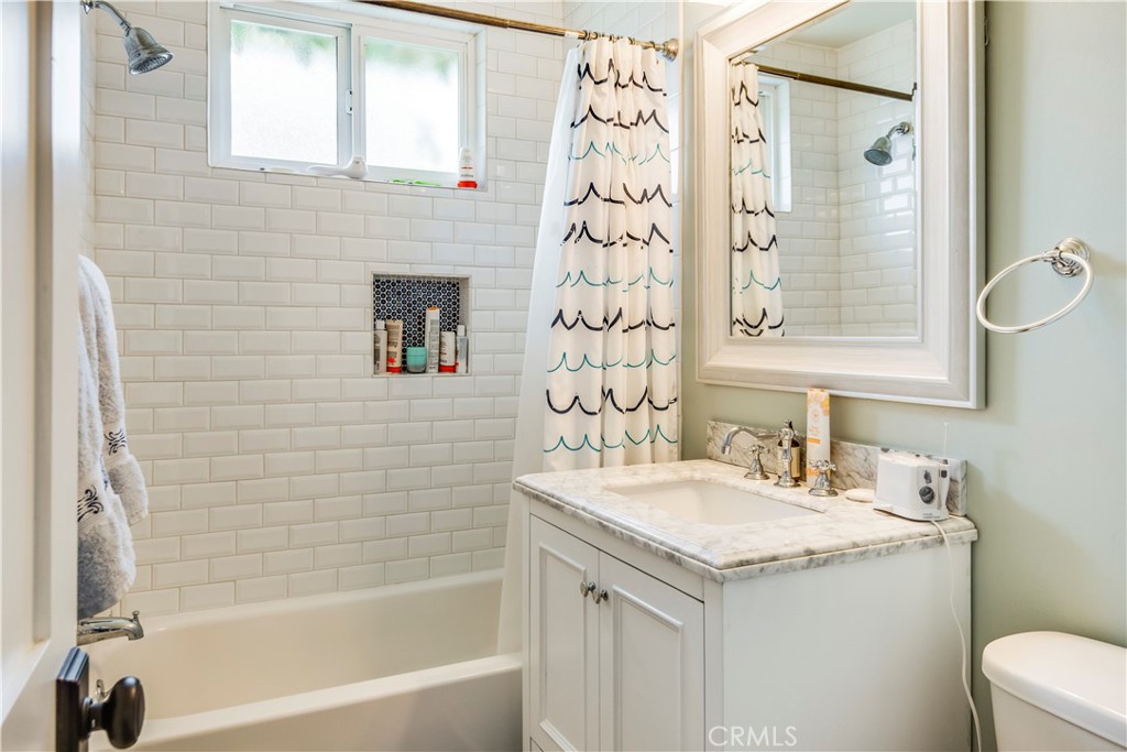 2505 Vail Avenue Redondo Beach, CA 90278 - Photo 30 of 41 a bathroom with a granite countertop sink and a mirror