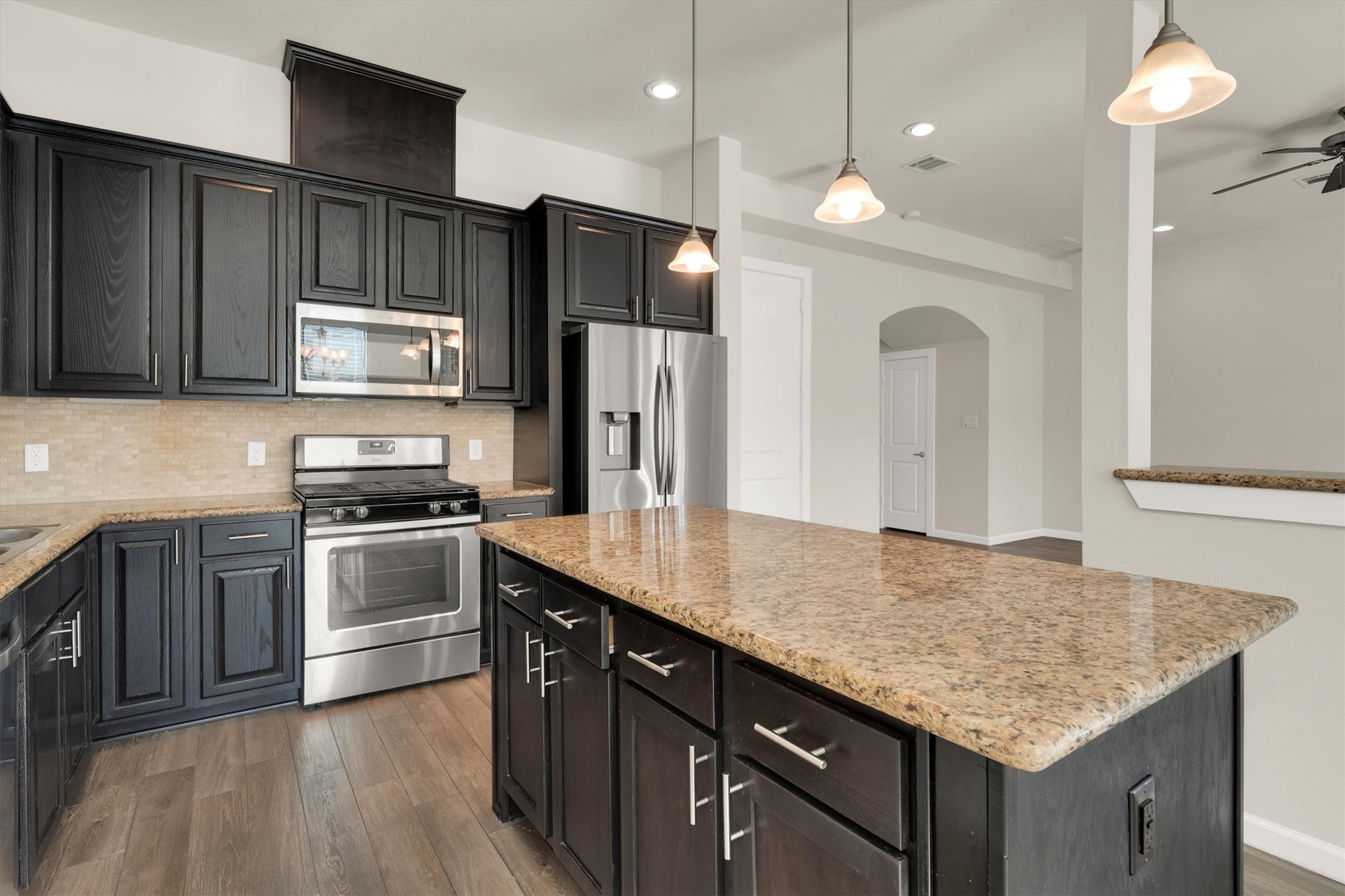 9405 Blalock Tree Court Houston, TX 77080 - Photo 14 of 39 a kitchen with stainless steel appliances granite countertop a sink refrigerator and microwave