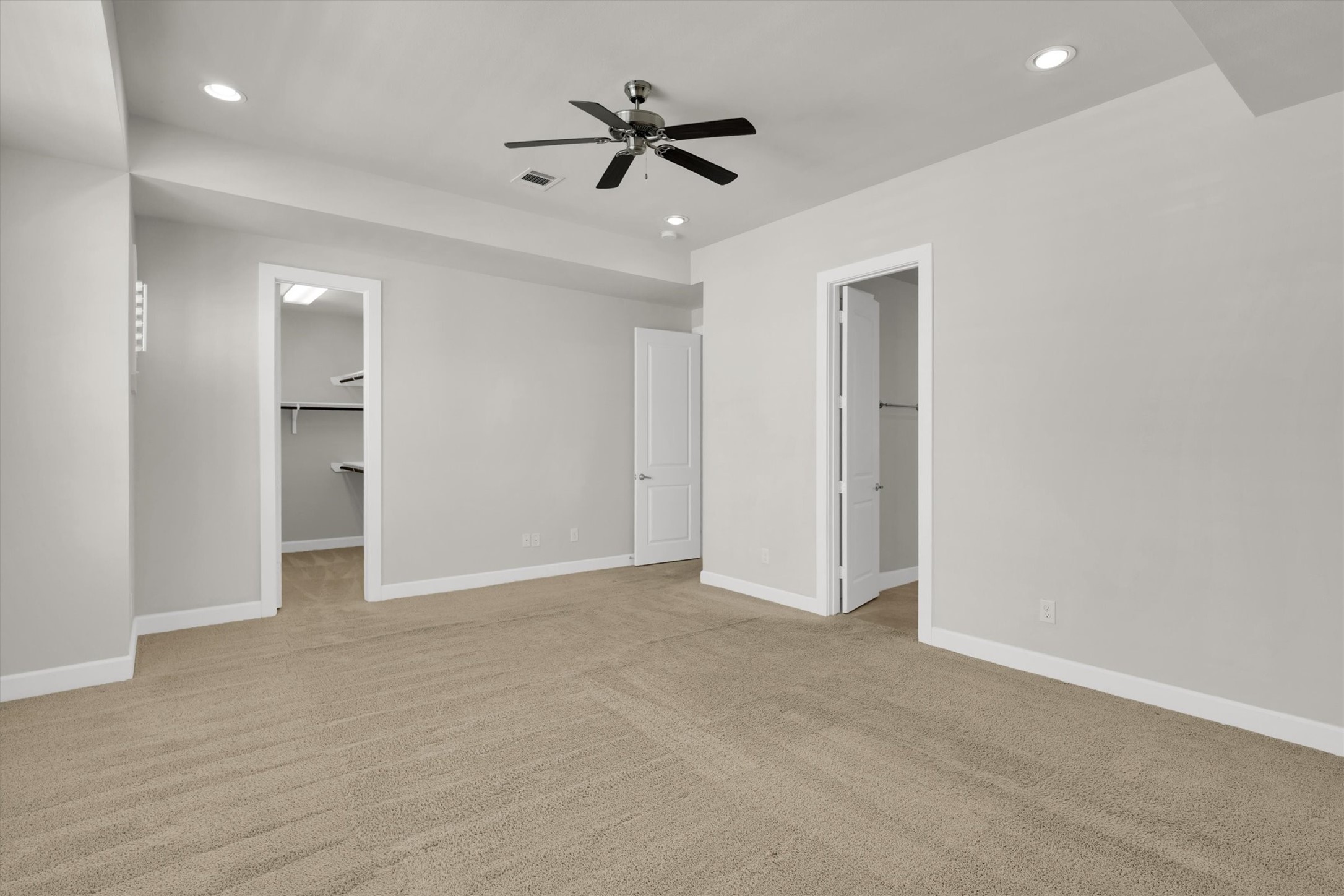 9405 Blalock Tree Court Houston, TX 77080 - Photo 23 of 39 wooden floor in an empty room with a ceiling fan