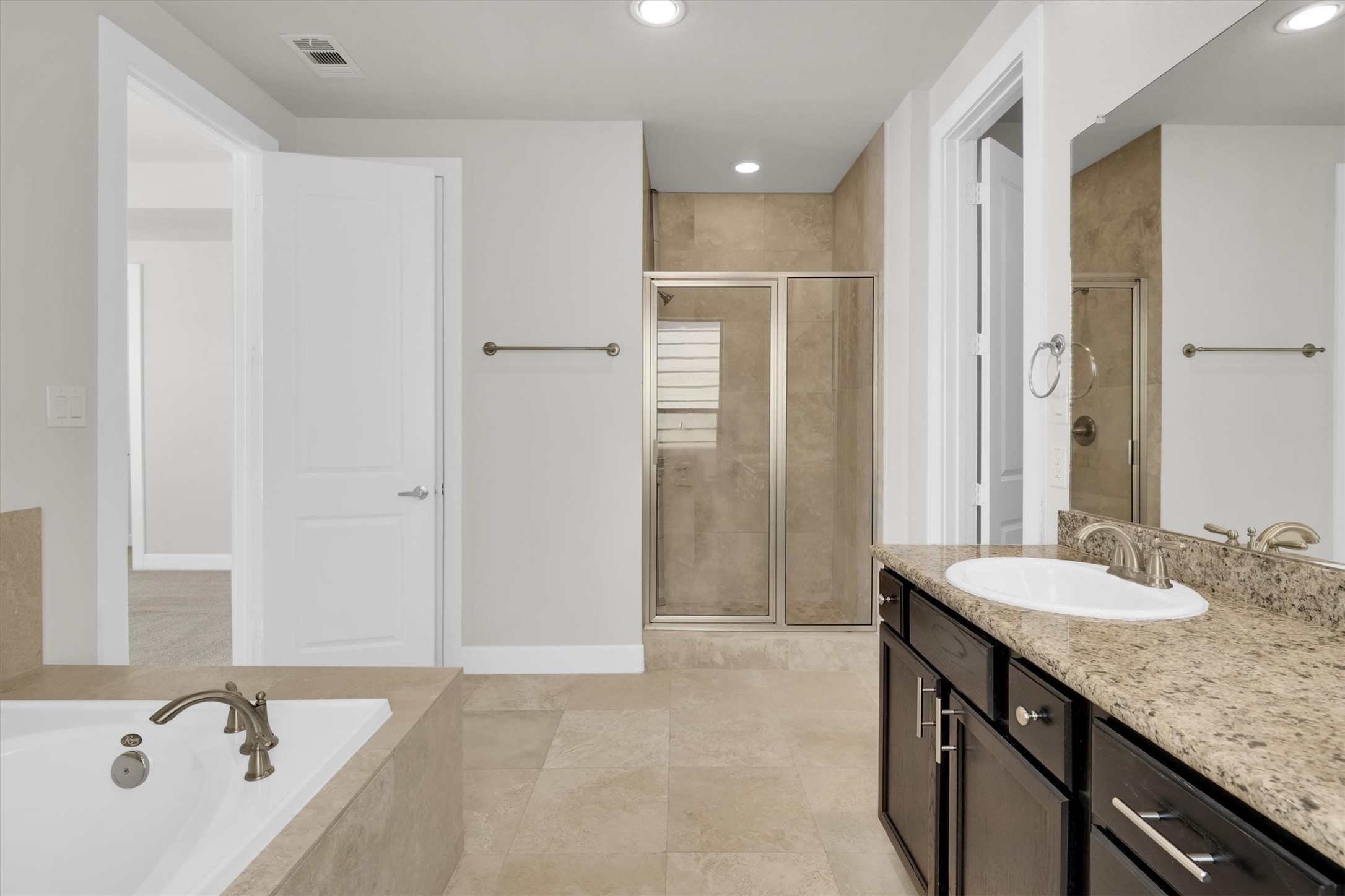 9405 Blalock Tree Court Houston, TX 77080 - Photo 28 of 39 a bathroom with a granite countertop sink and a mirror