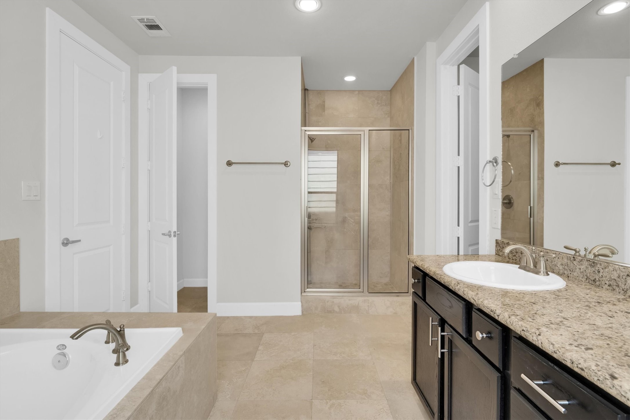 9405 Blalock Tree Court Houston, TX 77080 - Photo 29 of 39 a bathroom with a granite countertop sink and a mirror