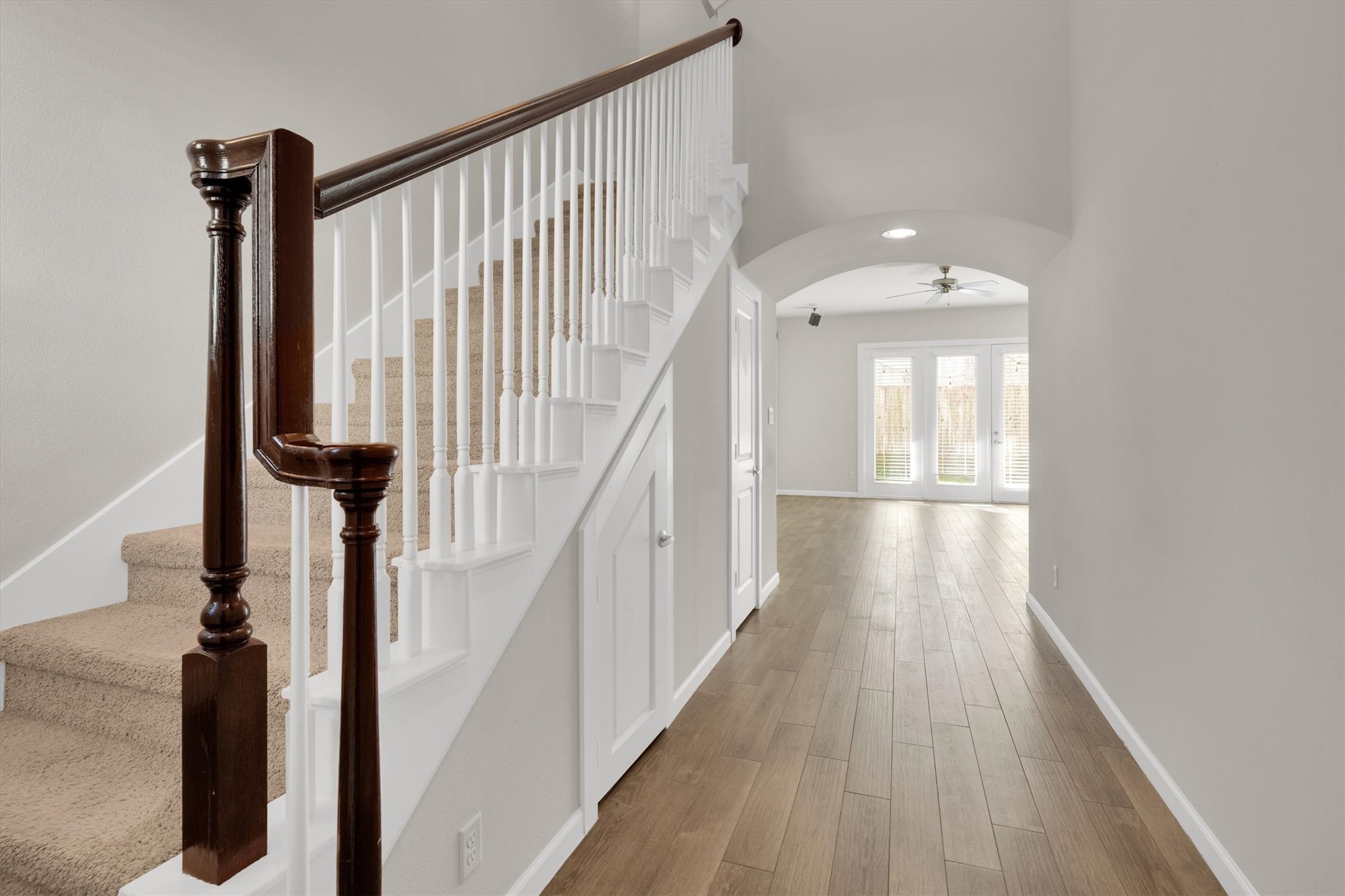 9405 Blalock Tree Court Houston, TX 77080 - Photo 4 of 39 a view of a hallway with wooden floor and staircase