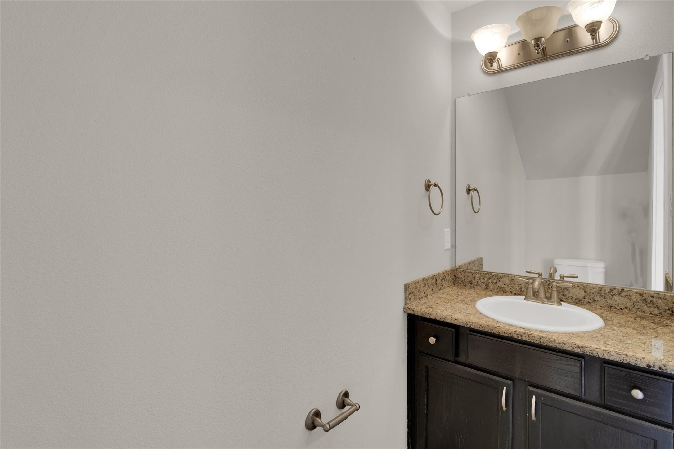 9405 Blalock Tree Court Houston, TX 77080 - Photo 5 of 39 a bathroom with a granite countertop sink and a mirror