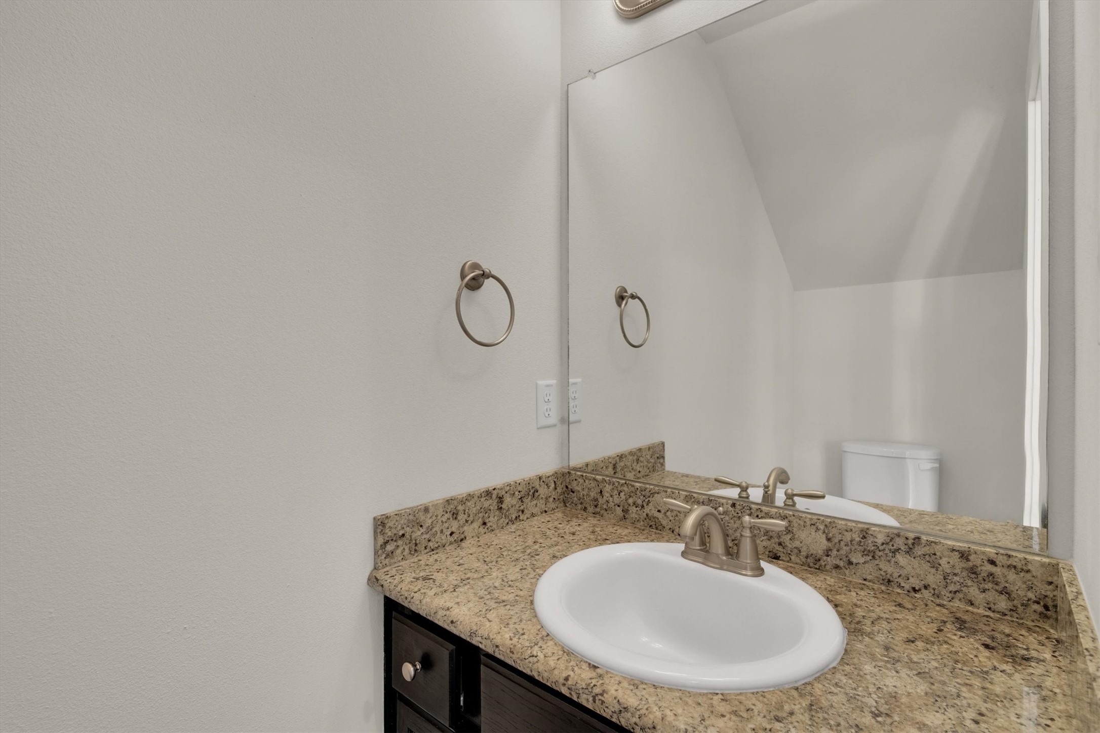 9405 Blalock Tree Court Houston, TX 77080 - Photo 6 of 39 a bathroom with a sink and a mirror