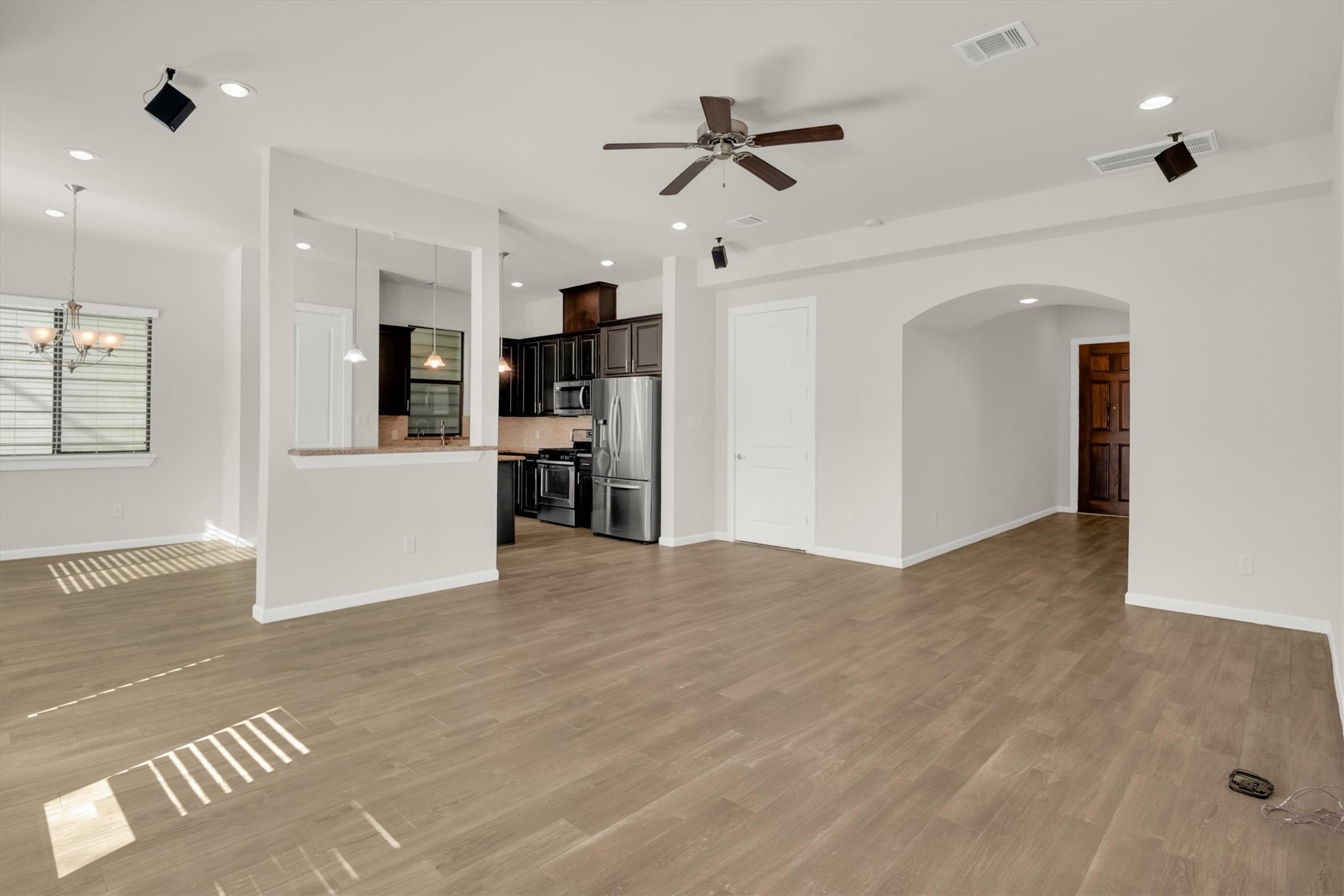 9405 Blalock Tree Court Houston, TX 77080 - Photo 9 of 39 a view of a livingroom with a furniture ceiling fan and window