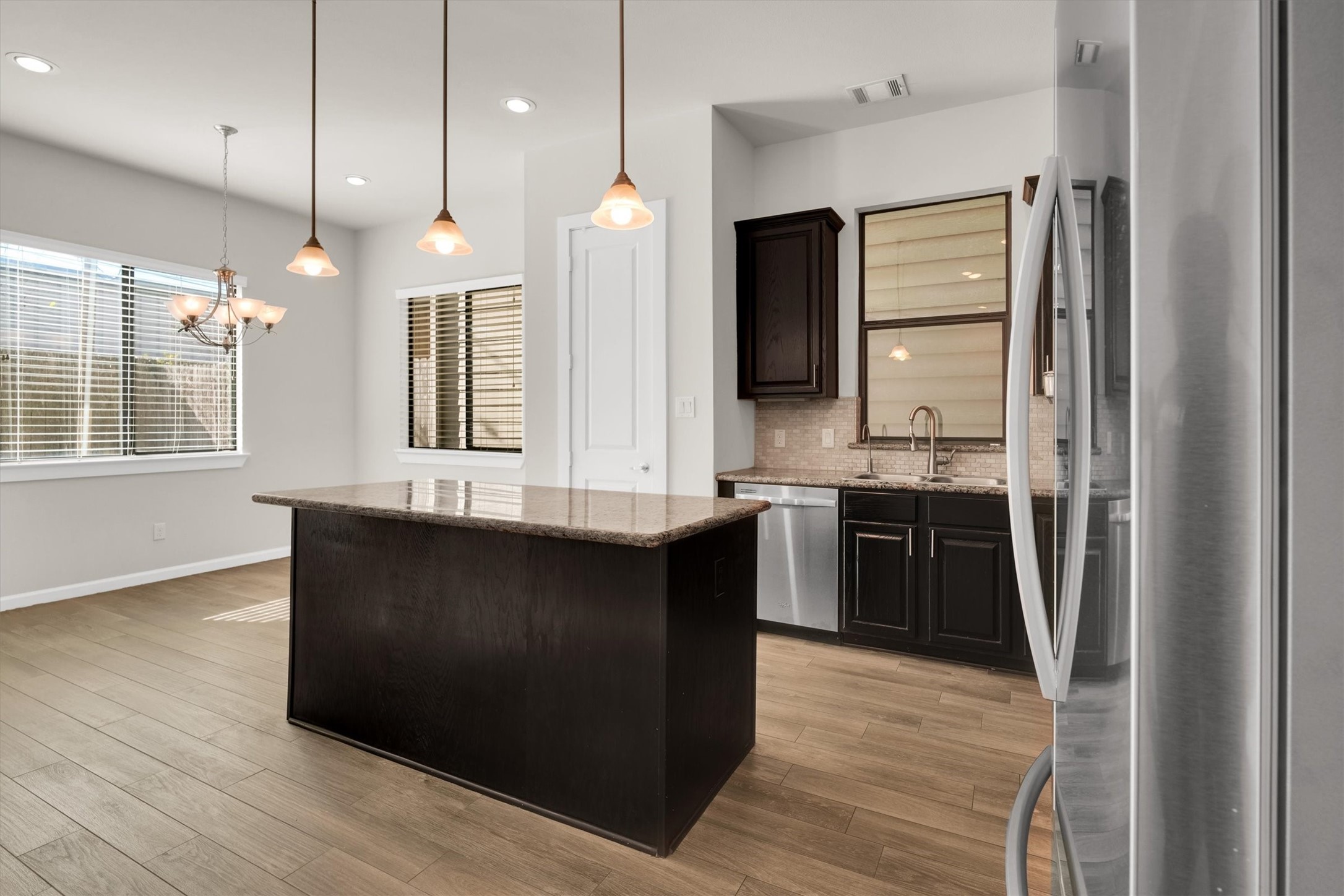 9405 Blalock Tree Court Houston, TX 77080 - Photo 10 of 39 a large kitchen with a large counter top appliances and cabinets