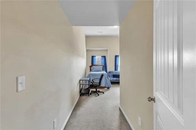 a view of a hallway with windows