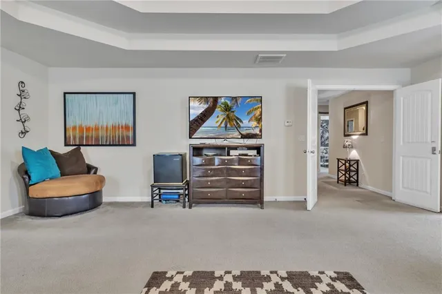 a view of a patio with table and chairs