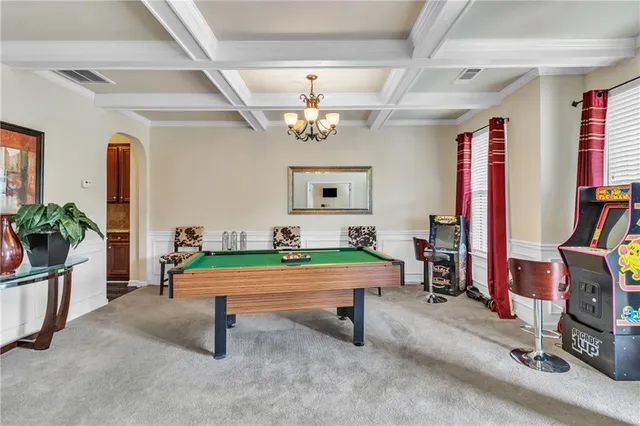 a room with pool table table tennis pool table and windows