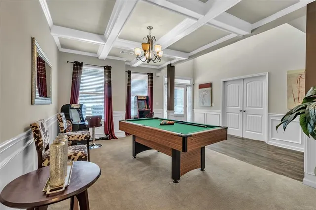 a bedroom with furniture and a lamp