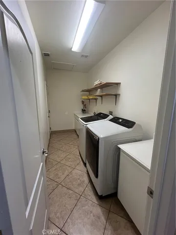a utility room with washer and dryer